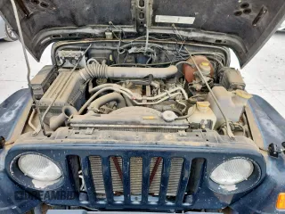 2000 Jeep Wrangler Sahara with VIN 1J4FA59S1YP777549, listed as a Copart auction lot 63622335 with 197,426 mi miles and Clean title. Bid and sale history available at DreamBid. Image 11.