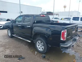 2015 GMC Canyon 2WD SLE with VIN 1GTG5BE3XF1226497, listed as a IAAI auction lot 42106960 with 97,360 mi miles and . Bid and sale history available at carsss.com. Image 3.
