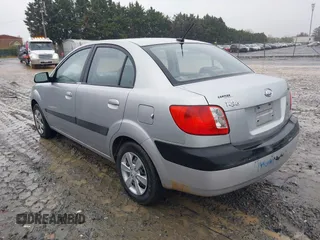 2009 Kia Rio SX with VIN KNADE223596538965, listed as a IAAI auction lot 42029409 with 143,794 mi miles. Bid and sale history available at carsss.com. Image 3.