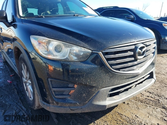 2016 Mazda CX-5 Sport with VIN JM3KE4BY0G0662294, listed as a IAAI auction lot 41469721 with 127,116 mi miles and . Bid and sale history available at carsss.com. Image 6.