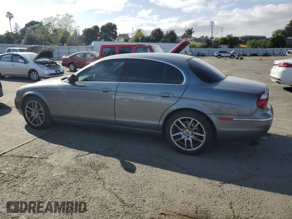 2005 Jaguar S-Type with VIN SAJWA01T15FN13800, listed as a Copart auction lot 53576305 with 182,533 mi miles and Salvage Title. Bid and sale history available at DreamBid. Image 2.