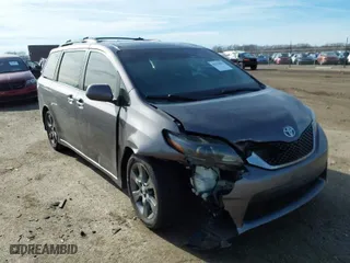 2015 Toyota Sienna SE with VIN 5TDXK3DC8FS633124, listed as a IAAI auction lot 41475935 with 182,921 mi miles. Bid and sale history available at carsss.com. Image 1.