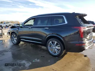 2023 Cadillac XT6 FWD Premium Luxury z VIN 1GYKPCRS6PZ127331, wystawiony jako Copart lot #88802755 z przebiegiem 47 796 mil mil oraz Szkoda całkowita • Salvage title. Historia ofert i sprzedaży dostępna na DreamBid. Obrazek 2.