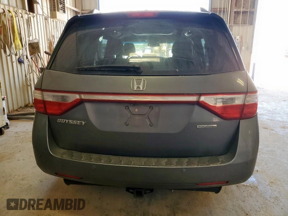 2012 Honda Odyssey Touring с VIN 5FNRL5H94CB049626, выставлен на аукционе Copart как лот 61191435 с пробегом 199 728 миль миль и Списание • Salvage title. История ставок и продаж доступна на DreamBid. Изображение 6.