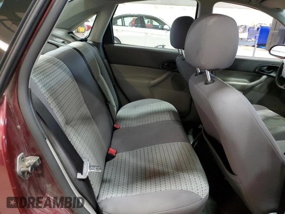 2006 Ford Focus S z VIN 1FAFP34N76W153239, wystawiony jako Copart lot #53085555 z przebiegiem 118 259 mil mil oraz Szkody całkowita. Historia ofert i sprzedaży dostępna na DreamBid. Obrazek 10.