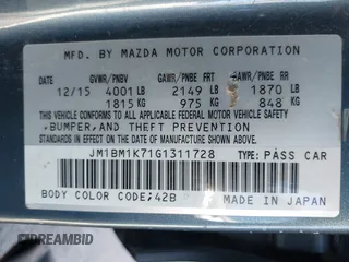 2016 Mazda 3 i Sport with VIN JM1BM1K71G1311728, listed as a IAAI auction lot 41595760 with 125,775 mi miles and . Bid and sale history available at DreamBid. Image 9.