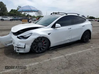 2022 Tesla Model Y Performance with VIN 7SAYGDEF6NF336752, listed as a Copart auction lot 56563885 with 52,915 mi miles and Salvage title. Bid and sale history available at DreamBid. Image 1.
