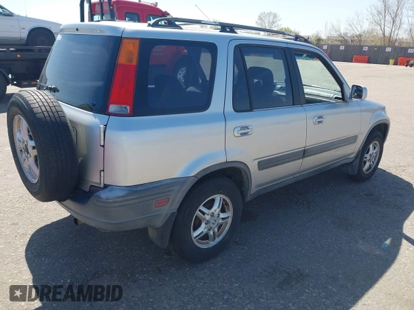 1999 Honda CR-V EX with VIN JHLRD1860XC056641, listed as a IAAI auction lot 42018329 with 321,707 mi miles. Bid and sale history available at carsss.com. Image 4.