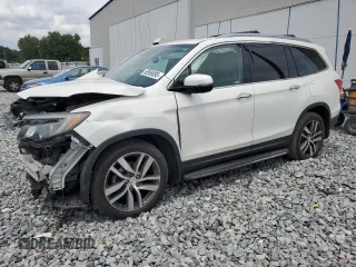 2017 Honda Pilot Touring with VIN 5FNYF6H99HB090155, listed as a Copart auction lot 55959095 with 53,232 mi miles and Salvage title. Bid and sale history available at DreamBid. Image 1.