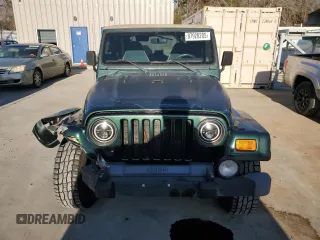 2000 Jeep Wrangler Sahara with VIN 1J4FA59S0YP795198, listed as a Copart auction lot 87920205 with 150,148 mi miles and Salvage Title. Bid and sale history available at carsss.com. Image 5.