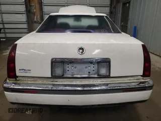 1992 Cadillac Eldorado z VIN 1G6EL13B8NU614555, wystawiony jako Copart lot #73767514 z przebiegiem 88 448 mil mil oraz Tytuł czysty. Historia ofert i sprzedaży dostępna na DreamBid. Obrazek 6.