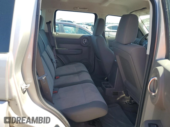 2009 Dodge Nitro SE z VIN 1D8GT28K19W541402, wystawiony jako Copart lot #57487874 z przebiegiem 189 653 mil mil oraz Szkoda całkowita • Salvage title. Historia ofert i sprzedaży dostępna na DreamBid. Obrazek 10.