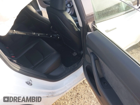 2023 Tesla Model 3 Long Range with VIN 5YJ3E1EB8PF600291, listed as a IAAI auction lot 41651156 with 37,055 mi miles and . Bid and sale history available at DreamBid. Image 8.