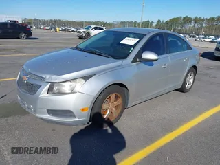 2014 Chevrolet Cruze 1LT with VIN 1G1PC5SB8E7201279, listed as a IAAI auction lot 41851574 with 125,806 mi miles and . Bid and sale history available at DreamBid. Image 2.