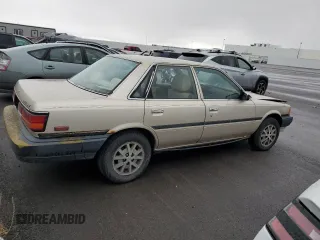 1991 Toyota Camry z VIN 4T1SV24E0MU379572, wystawiony jako Copart lot #78090294 z przebiegiem 242 052 mil mil oraz Szkoda całkowita • Salvage title. Historia ofert i sprzedaży dostępna na DreamBid. Obrazek 3.