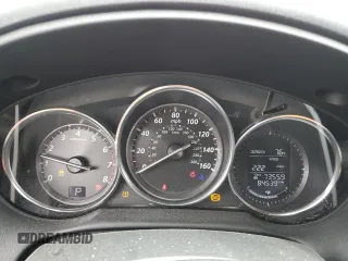 2014 Mazda CX-5 Touring z VIN JM3KE4CY3E0382106, wystawiony jako Copart lot #55521645 z przebiegiem 84 539 mil mil oraz Szkoda całkowita • Salvage title. Historia ofert i sprzedaży dostępna na DreamBid. Obrazek 9.