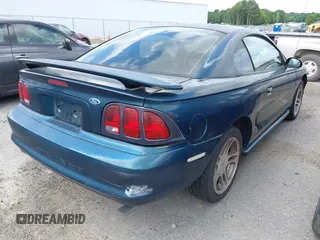 1996 Ford Mustang GT z VIN 1FALP42XXTF137304, wystawiony jako IAAI lot #42464808 z przebiegiem 166 565 mil mil oraz . Historia ofert i sprzedaży dostępna na DreamBid. Obrazek 4.