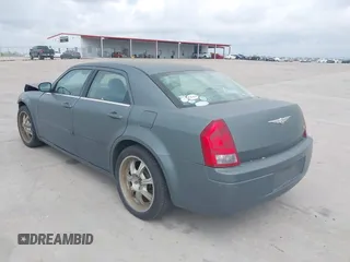 2006 Chrysler 300 with VIN 2C3KA43R56H217771, listed as a IAAI auction lot 41859397 with 154,227 mi miles. Bid and sale history available at carsss.com. Image 3.