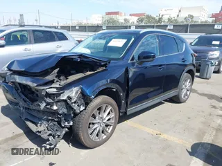 2020 Mazda CX-5 Grand Touring with VIN JM3KFADM6L1830093, listed as a IAAI auction lot 41699672 with 66,769 mi miles. Bid and sale history available at carsss.com. Image 19.