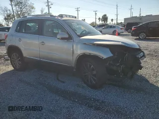 2014 Volkswagen Tiguan SE z VIN WVGAV3AXXEW502310, wystawiony jako Copart lot #42095985 z przebiegiem 130 033 mil mil oraz Szkoda całkowita • Salvage title. Historia ofert i sprzedaży dostępna na DreamBid. Obrazek 4.