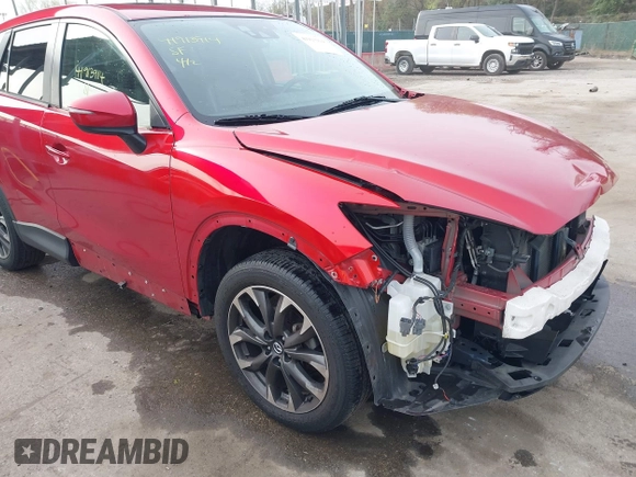2016 Mazda CX-5 Grand Touring with VIN JM3KE4DY9G0865780, listed as a IAAI auction lot 41913914 with 76,579 mi miles. Bid and sale history available at carsss.com. Image 19.