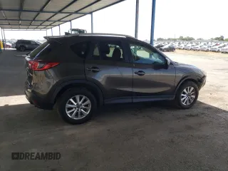 2016 Mazda CX-5 Touring z VIN JM3KE2CY4G0805072, wystawiony jako Copart lot #58435535 z przebiegiem 146 323 mil mil oraz Szkoda całkowita • Salvage title. Historia ofert i sprzedaży dostępna na DreamBid. Obrazek 3.