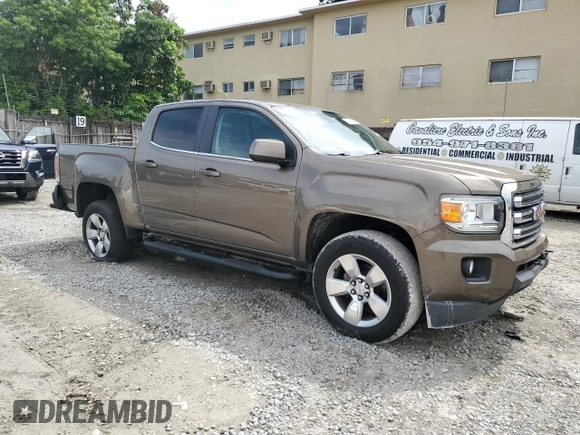 2015 GMC Canyon 4WD SLE with VIN 1GTG6BE38F1263139, listed as a Copart auction lot 75479854 with 124,765 mi miles and Salvage Title. Bid and sale history available at carsss.com. Image 4.
