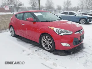2014 Hyundai Veloster with VIN KMHTC6AD8EU214612, listed as a IAAI auction lot 41258820 with 61,984 mi miles. Bid and sale history available at carsss.com. Image 1.