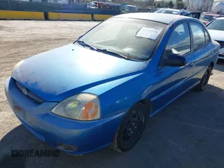 2003 Kia Rio with VIN KNADC125936239472, listed as a IAAI auction lot 41729536 with 156,421 mi miles. Bid and sale history available at carsss.com. Image 2.
