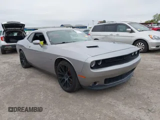 2017 Dodge Challenger R/T Shaker z VIN 2C3CDZBT3HH651390, wystawiony jako IAAI lot #41097999 z przebiegiem 128 289 mil mil oraz . Historia ofert i sprzedaży dostępna na DreamBid. Obrazek 1.