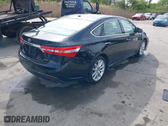 2014 Toyota Avalon Limited with VIN 4T1BK1EB5EU129821, listed as a IAAI auction lot 42085414 with 113,729 mi miles. Bid and sale history available at carsss.com. Image 4.
