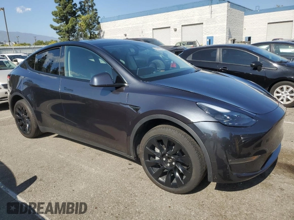 2024 Tesla Model Y with VIN 7SAYGDED7RF056973, listed as a Copart auction lot 55310705 with 15,391 mi miles and Salvage Title. Bid and sale history available at DreamBid. Image 4.