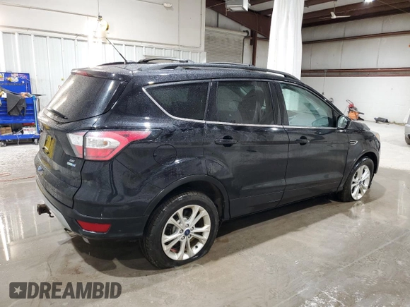 2017 Ford Escape SE with VIN 1FMCU9G96HUE03765, listed as a Copart auction lot 51468405 with 96,963 mi miles and Salvage Title. Bid and sale history available at carsss.com. Image 3.