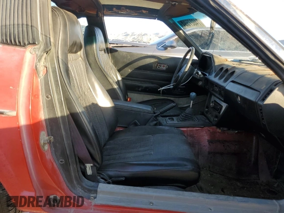1983 Datsun 280ZX z VIN JN1HZ04S0DX569855, wystawiony jako Copart lot #74027594 z przebiegiem 12 300 mil mil oraz Szkody całkowita. Historia ofert i sprzedaży dostępna na DreamBid. Obrazek 10.