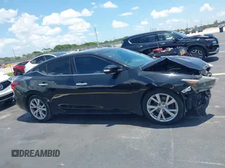2016 Nissan Maxima S z VIN 1N4AA6AP3GC434993, wystawiony jako IAAI lot #42457183 z przebiegiem 100 569 mil mil oraz . Historia ofert i sprzedaży dostępna na DreamBid. Obrazek 13.