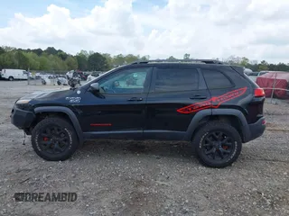 2015 Jeep Cherokee Trailhawk with VIN 1C4PJMBS5FW792184, listed as a IAAI auction lot 41827106 with 132,752 mi miles. Bid and sale history available at carsss.com. Image 14.