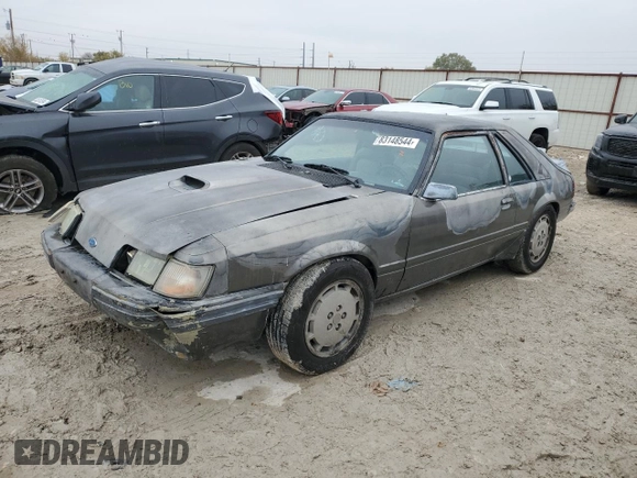1986 Ford Mustang with VIN 1FABP28T8GF109009, listed as a Copart auction lot 83148544 with 329,005 mi miles and Salvage title. Bid and sale history available at DreamBid. Image 1.