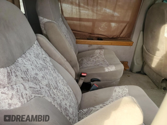2004 Chevrolet Express Passenger z VIN 1GBFG15X641214559, wystawiony jako Copart lot #78751864 z przebiegiem 162 991 mil mil oraz Szkoda całkowita • Salvage title. Historia ofert i sprzedaży dostępna na DreamBid. Obrazek 12.