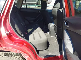 2014 Mazda CX-5 Touring with VIN JM3KE2CY2E0374440, listed as a IAAI auction lot 41634144 with 106,145 mi miles and . Bid and sale history available at DreamBid. Image 8.