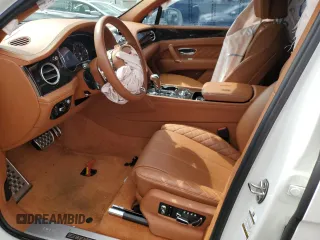 2019 Bentley Bentayga V8 z VIN SJAAM2ZV4KC026896, wystawiony jako Copart lot #57332313 z przebiegiem Nie podano mil oraz . Historia ofert i sprzedaży dostępna na DreamBid. Obrazek 7.