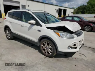 2016 Ford Escape Titanium with VIN 1FMCU9J94GUB31594, listed as a Copart auction lot 51690565 with 119,699 mi miles and Salvage Title. Bid and sale history available at DreamBid. Image 4.
