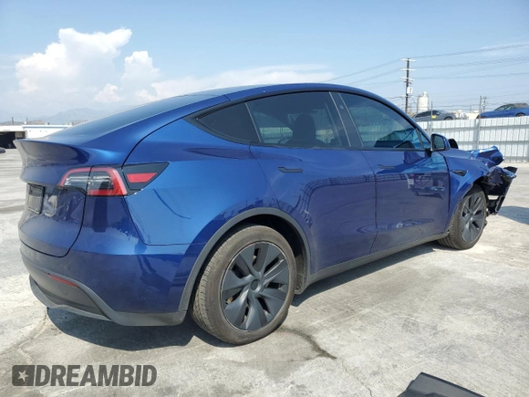 2024 Tesla Model Y with VIN 7SAYGDED0RF102479, listed as a Copart auction lot 55431975 with 23,989 mi miles and Salvage title. Bid and sale history available at DreamBid. Image 3.
