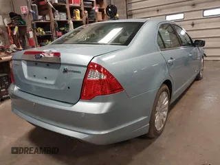 2010 Ford Fusion Hybrid z VIN 3FADP0L34AR276532, wystawiony jako IAAI lot #41491883 z przebiegiem 159 076 mil mil oraz . Historia ofert i sprzedaży dostępna na DreamBid. Obrazek 4.
