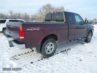 2000 Ford F-150 XL with VIN 1FTRX18L2YNA50128, listed as a IAAI auction lot 40956879 with 1 mi miles. Bid and sale history available at carsss.com. Image 4.