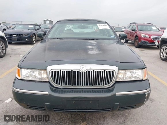 2002 Mercury Grand Marquis LS Premium z VIN 2MEFM75WX2X626520, wystawiony jako IAAI lot #42374203 z przebiegiem 139 692 mil mil oraz . Historia ofert i sprzedaży dostępna na DreamBid. Obrazek 6.
