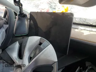 2023 Tesla Model Y Long Range z VIN 7SAYGDEE3PA077841, wystawiony jako Copart lot #54535215 z przebiegiem Nie podano mil oraz Szkoda całkowita • Salvage title. Historia ofert i sprzedaży dostępna na DreamBid. Obrazek 9.