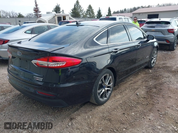 2019 Ford Fusion Hybrid Titanium with VIN 3FA6P0RU4KR144445, listed as a IAAI auction lot 42059840 with 90,617 mi miles. Bid and sale history available at carsss.com. Image 4.
