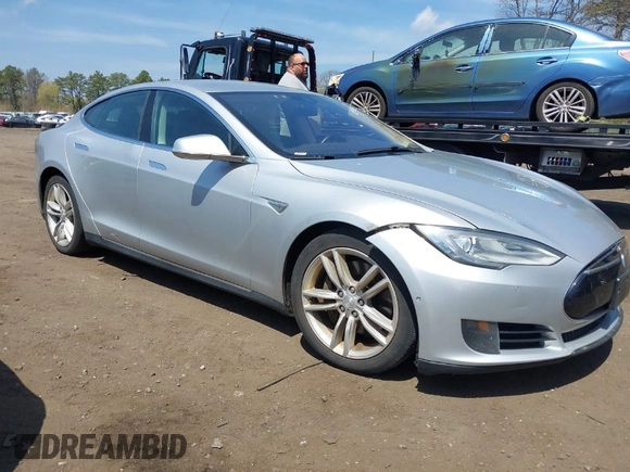 2015 Tesla Model S 85D with VIN 5YJSA1H2XFF084145, listed as a IAAI auction lot 42101755 with 105,660 mi miles. Bid and sale history available at carsss.com. Image 1.