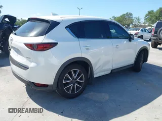 2018 Mazda CX-5 Grand Touring with VIN JM3KFADM2J1422512, listed as a IAAI auction lot 42010801 with 48,567 mi miles and . Bid and sale history available at DreamBid. Image 4.