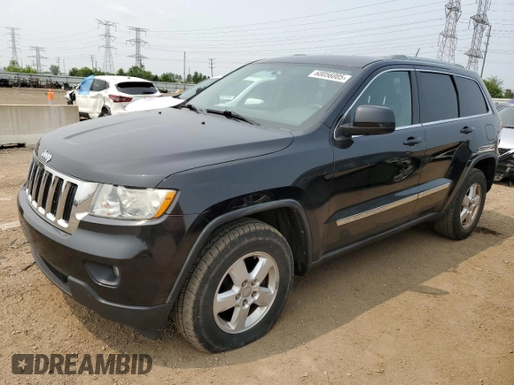 2011 Jeep Grand Cherokee Laredo with VIN 1J4RR4GGXBC567450, listed as a Copart auction lot 60056085 with 165,077 mi miles and Salvage title. Bid and sale history available at DreamBid. Image 1.